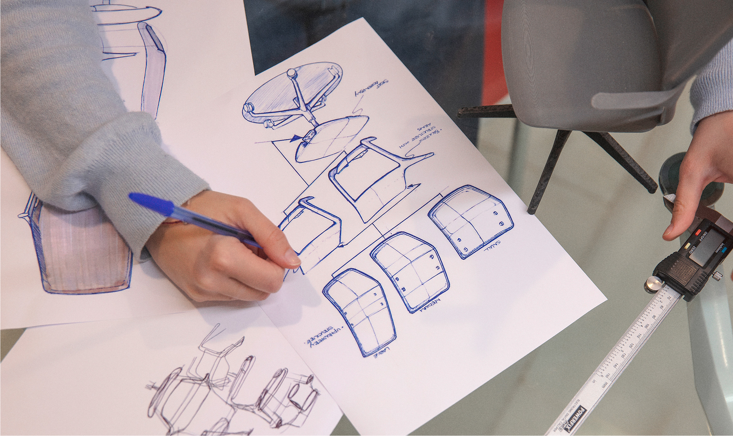 Sketches of the OFY chair by Alegre Design, showcasing the creative design process for Narbutas. These sketches highlight the innovative approach and ergonomic features developed by the professional design studio.